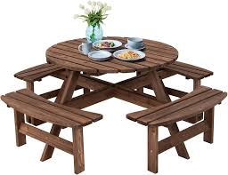 Il tavolo da picnic KOMFOTTEU è un set di tavoli da giardino realizzati in legno di alta qualità. Progettato per offrire comfort e funzionalità